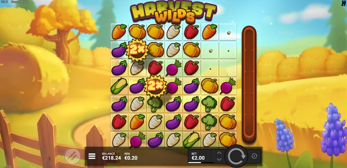 Harvest Wilds -slotin ruudukko, jossa sadonkorjuuteemaisia vihannes- ja hedelmäsymboleja.