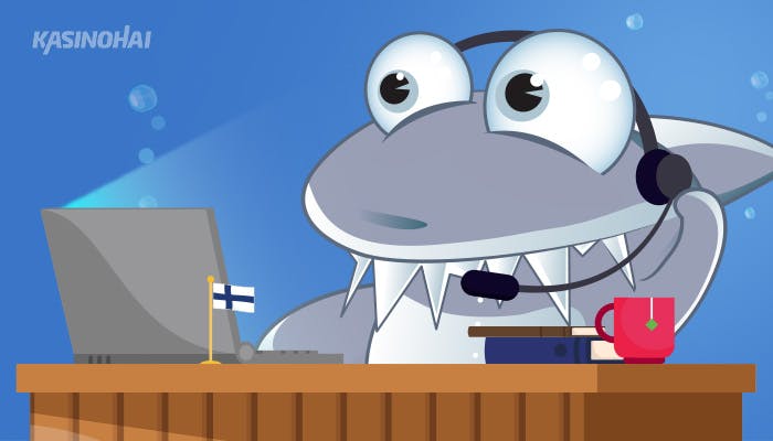 Kasinohai istuu työpöydän ääressä ja toimii suomalaisena asiakaspalvelijana.