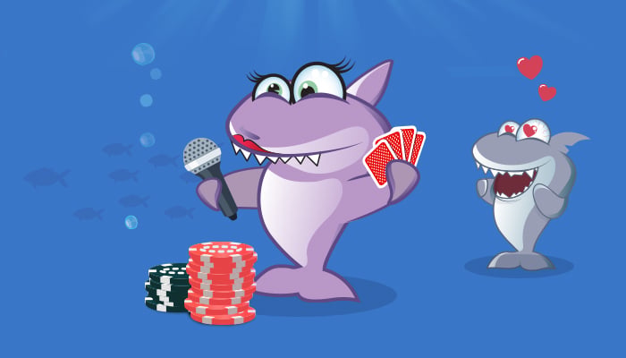 Pokerihai ottaa mikrofonin haltuun kortit evässään ja iso kasa pelimerkkejä edessään.
